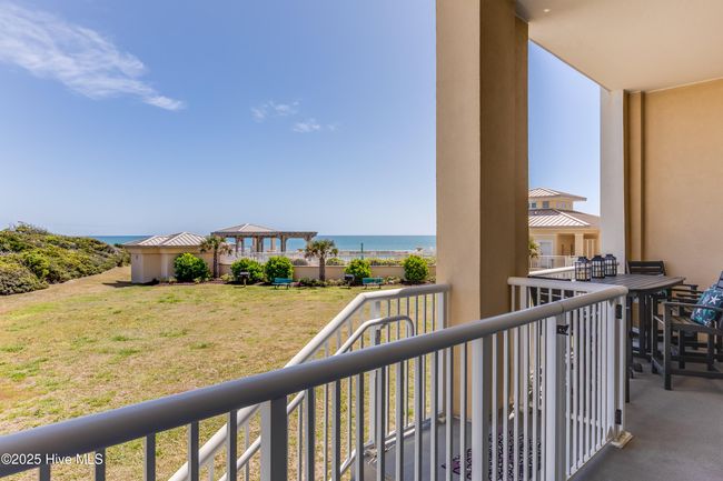 Specific only to first floor units, you'll love and appreciate the perk of having exterior steps to the outside from your private, oceanside balcony. You'll be at the pool or on the beach in a snap! | Image 26