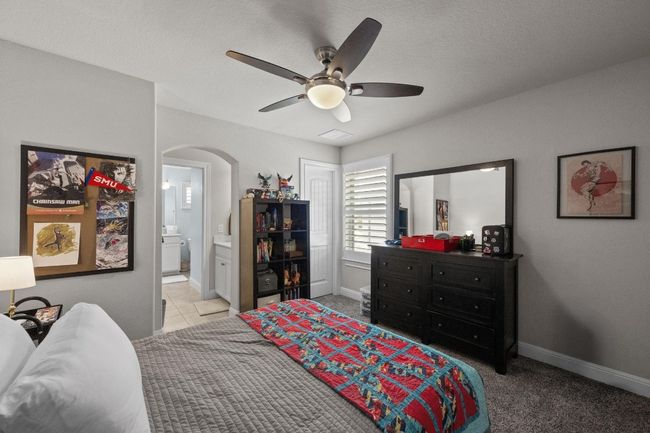 Bedroom featuring arched walkways, ensuite bathroom, and a ceiling​​‌​​​​‌​​‌‌​‌‌​​​‌‌​​‌‌​‌​​​​​‌ fan | Image 30
