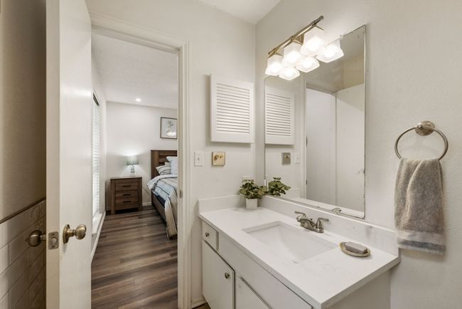Ensuite bathroom with vanity, wood finished floors, and ensuite bathroom | Image 15