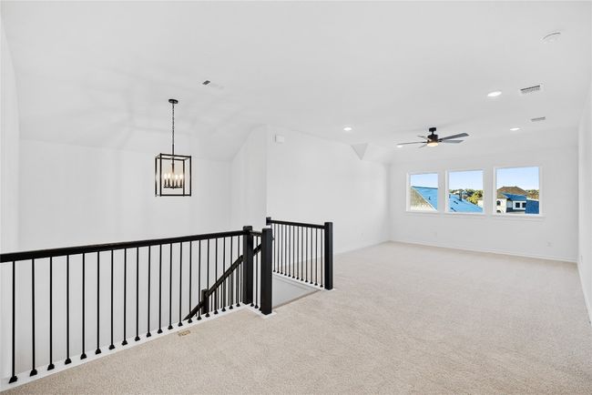 Corridor with an upstairs landing, carpet floors, recessed lighting, and a chandelier | Image 21