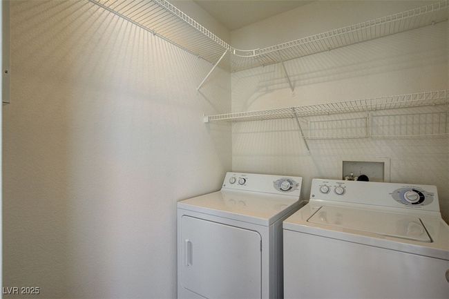 Laundry room featuring laundry area and washer and clothes dryer | Image 22