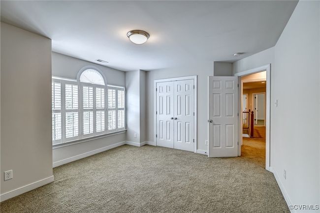bedroom, arched transom window & double door closet. | Image 25