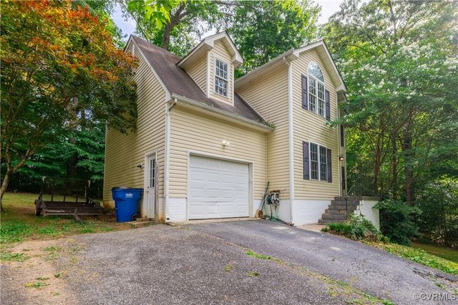 View of home's exterior featuring driveway | Image 26