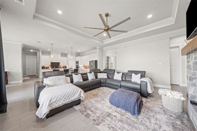 Tray ceiling, Open floor plan, spacious living. Remote controlled curtains for opening and closing. | Image 10