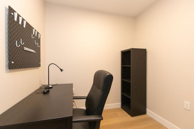 Unfurnished office featuring light wood-style flooring and baseboards | Image 16