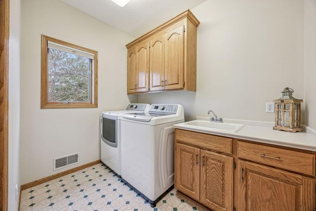 Main floor laundry just off the back hall entry. | Image 16