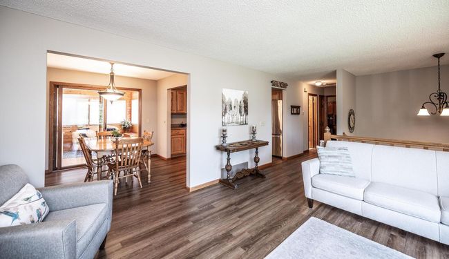 Living room opens to dining room & onto four-season porch. | Image 6