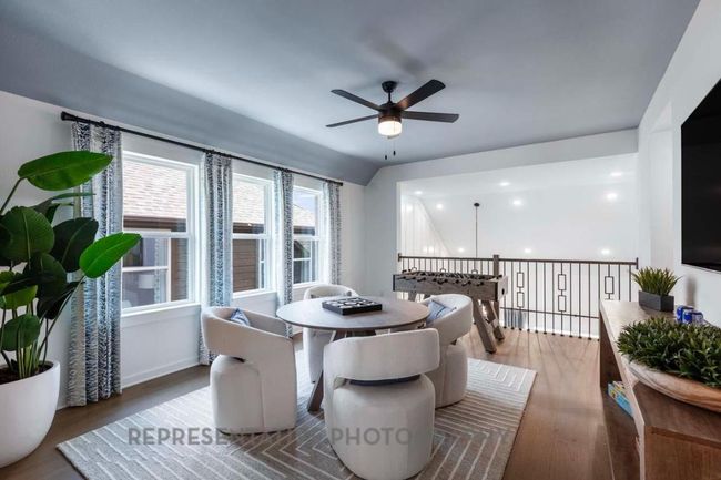 Dining room featuring a ceiling fan, wood finished floors, and recessed lighting | Image 34