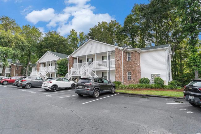 View of property with stairway and uncovered parking | Image 27