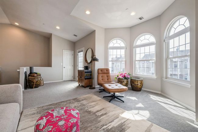 Sitting room featuring plenty of natural light, visible vents, and carpet | Image 4