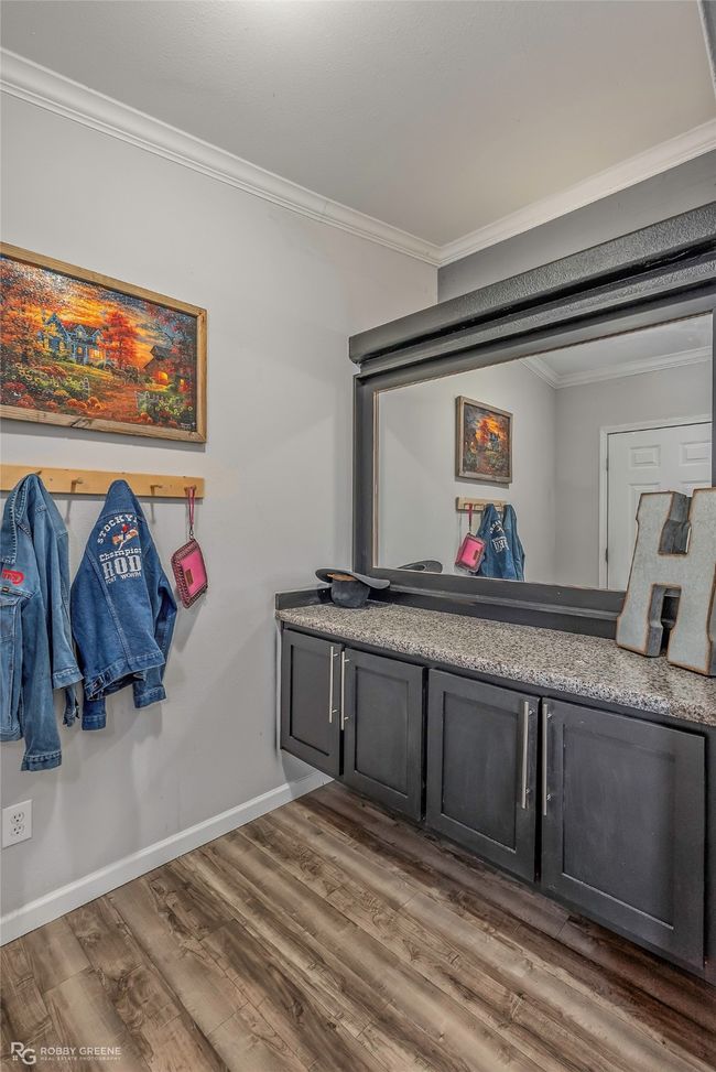 Mudroom featuring wood finished floors, crown molding, and baseboards | Image 34
