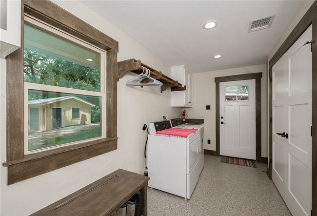 Laundry room featuring hookup for an electric dryer, cabinet space, and recessed lighting | Image 26