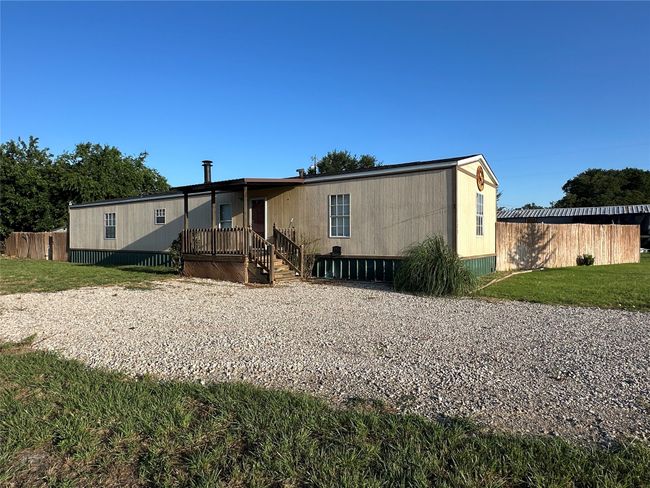 Rear view of house with a lawn | Image 38