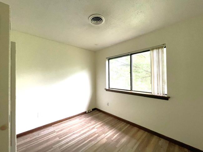 Unfurnished room featuring wood finished floors | Image 13