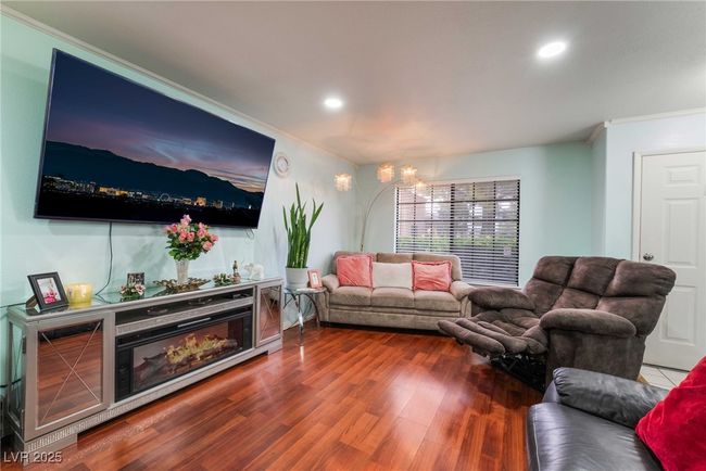 Living room with wood finished floors, recessed lighting, and ornamental molding | Image 7