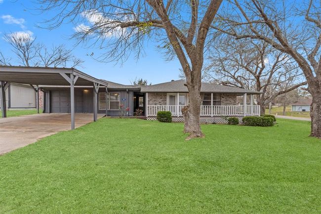 Charming single-story home with a spacious carport. | Image 6