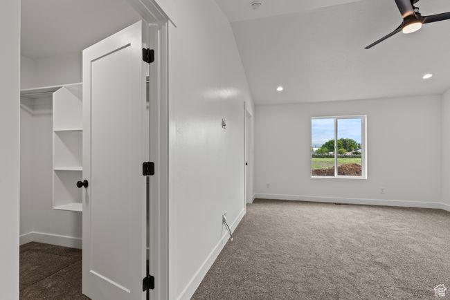 Spare room with baseboards, carpet flooring, ceiling fan, and recessed lighting | Image 9