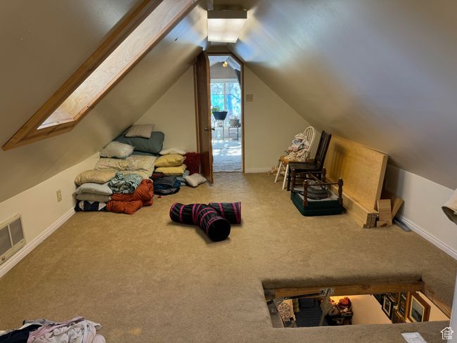 Unfurnished bedroom with lofted ceiling, carpet flooring, visible vents, and baseboards | Image 29