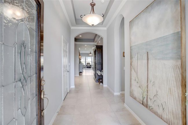A bright, elegant foyer invites you into one of the more unique floor plans in the neighborhood. | Image 4