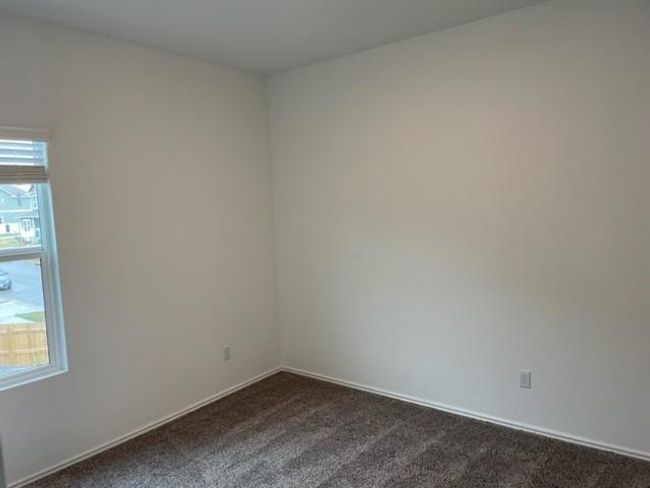 Spare room with dark colored carpet and baseboards | Image 14