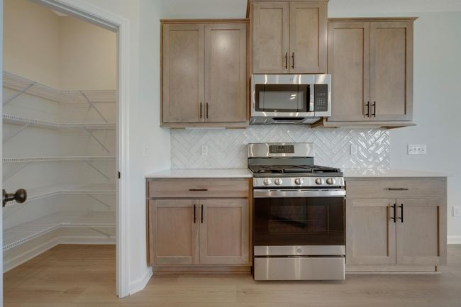 Spacious walk-in pantry and plenty of counter space | Image 9
