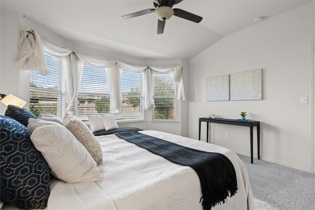 The primary bedroom is light and bright | Image 15