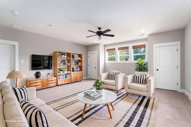 Living room with ceiling fan | Image 25