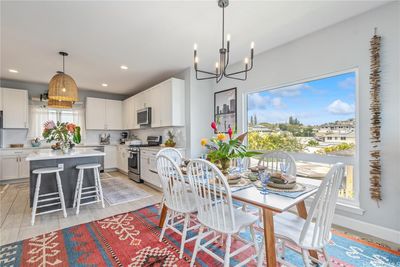 Open concept kitchen, dining area and living room. | Image 3