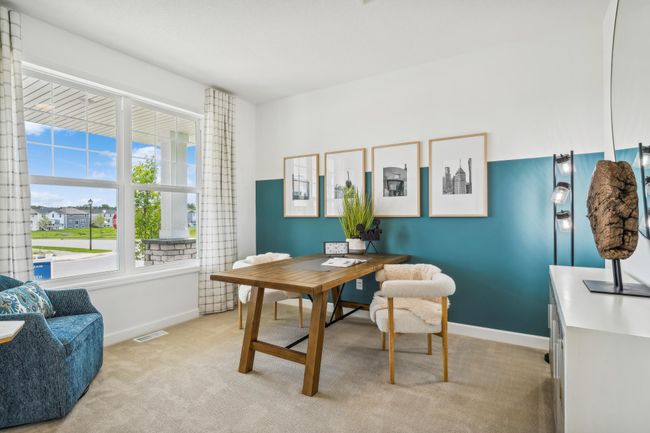 Photo is of the actual model. This main level study provides a perfect setting for those working from home, paying bills or completing a school project. | Image 9