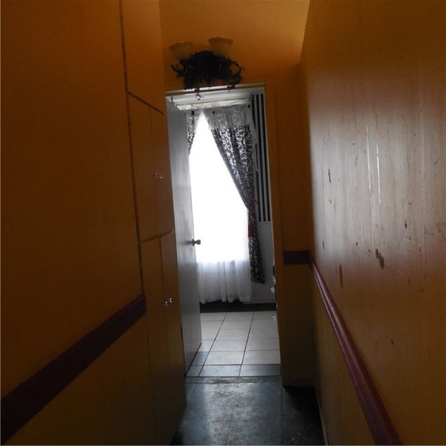 Hall leading to main bath on first floor | Image 13