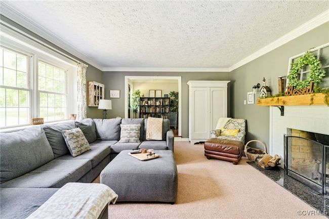 The fireplace in the family room was relined a few years ago | Image 9