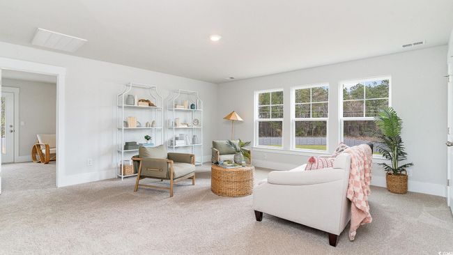 Carpeted living room featuring baseboards | Image 24