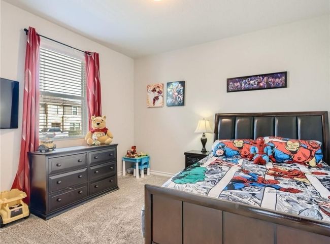 Bedroom featuring carpet and baseboards | Image 6