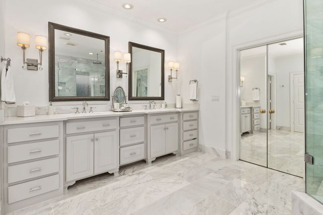Double Vanity with framed mirrors and marble flooring | Image 20