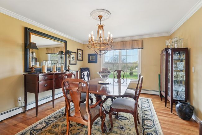 Dining area featuring recessed lighting, an inviting chandelier, and light wood-style flooring | Image 19