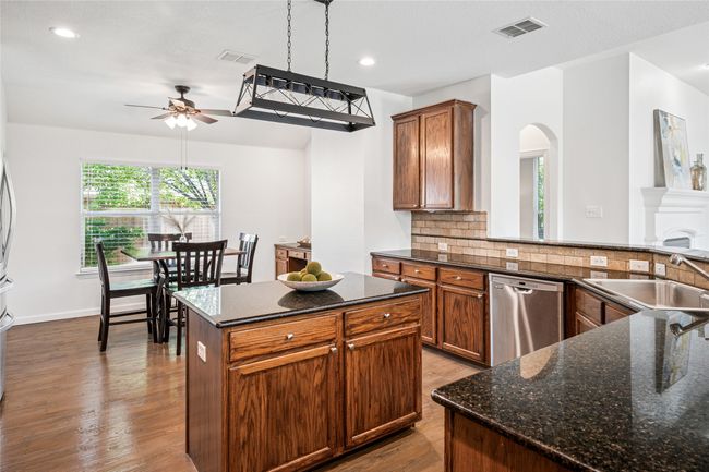 Additional dining area in the kitchen with dry bar. | Image 15