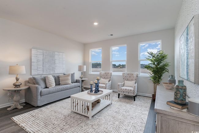 Living area with wood finished floors, plenty of natural light, and recessed lighting | Image 13