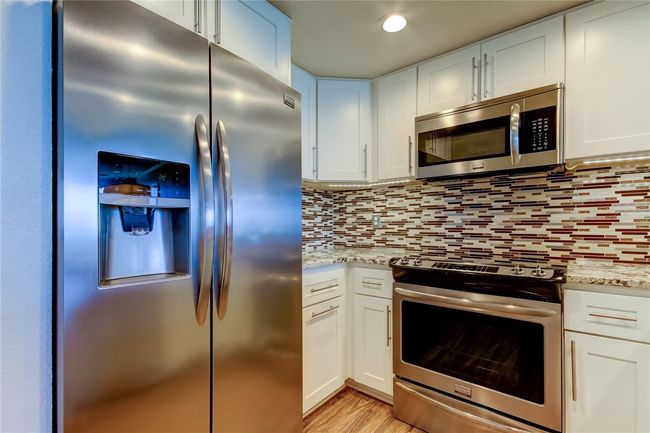 Kitchen with Stone Countertops, Stainless Steel Applicances | Image 21
