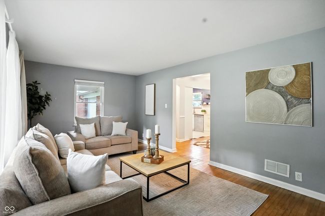 living area featuring baseboards and wood finished floors | Image 16