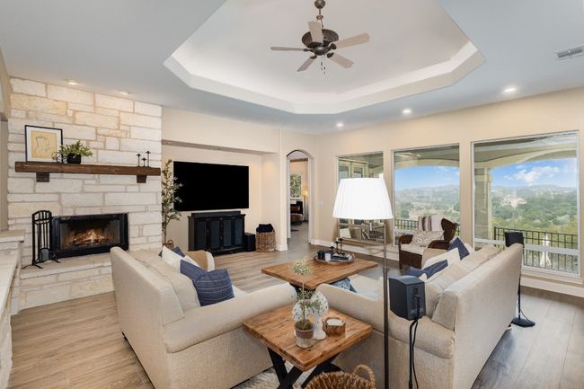 Replaced living room windows and LVP with no carpet throughout. | Image 5