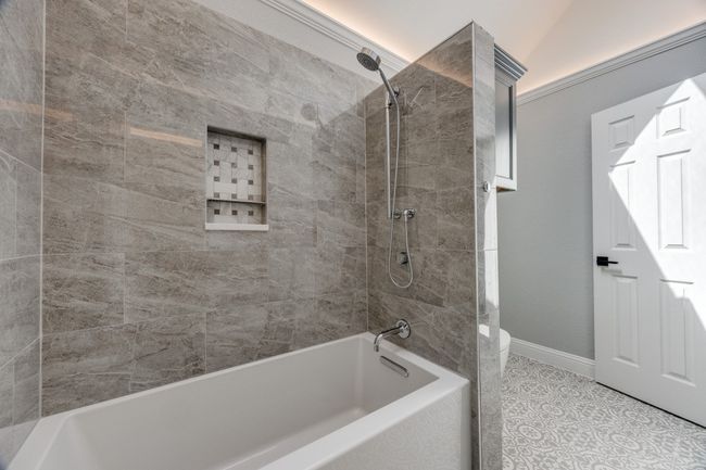 Full bath with washtub / shower combination and tile patterned floors | Image 20