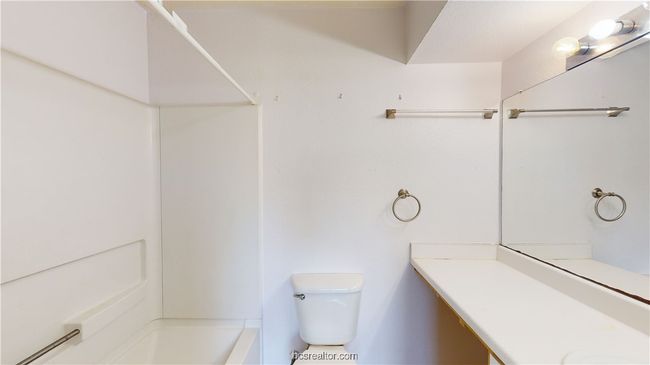 Bathroom featuring vanity and toilet | Image 19