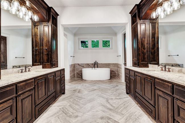 Then there is the primary bath! Two huge vanities with an abundance of storage space plus a deep freestanding tub! | Image 13
