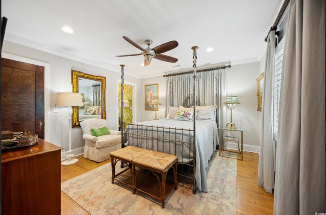 Bedroom with light wood-style floors, crown molding, recessed lighting, and ceiling fan | Image 13