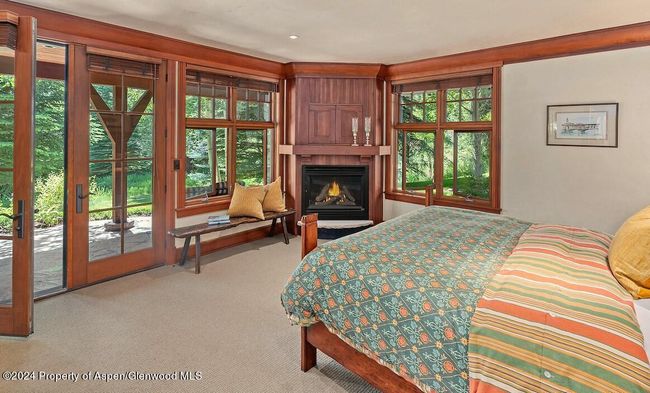 Located at the west end of the home on main level, with windows on two sides bringing in sounds and views of river. Walk out to patio. | Image 33