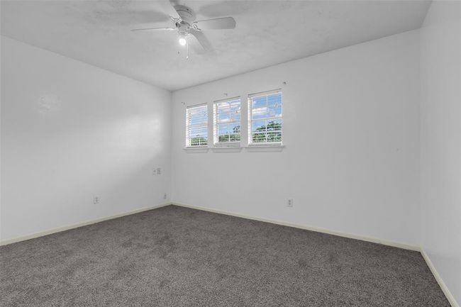 This empty secondary bedroom provides a blank canvas for you to personalize and make your own. | Image 21