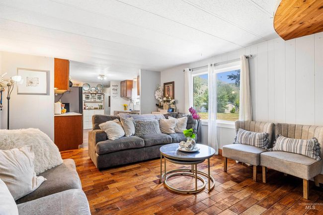 Living room featuring wood finished floors | Image 6