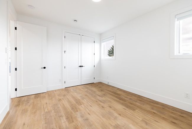 Unfurnished bedroom featuring light wood-style floors, baseboards, and a closet | Image 31