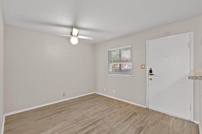Vinyl floor, with updated ceiling fan. | Image 9