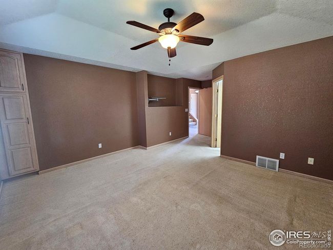 Primary bedroom has built-in storage along with a TV mount | Image 18